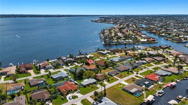 bird's eye view with a residential view and a water view