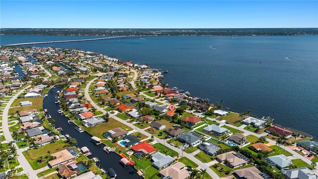 birds eye view of property featuring a residential view and a water view