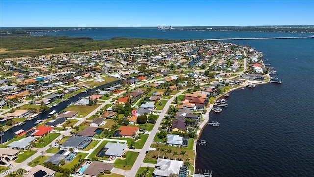 drone / aerial view with a residential view and a water view