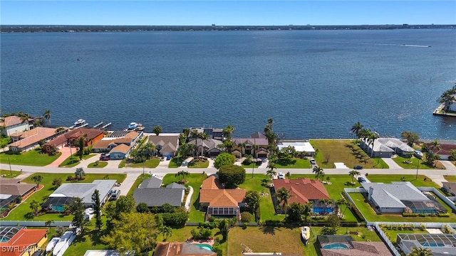 birds eye view of property with a residential view and a water view