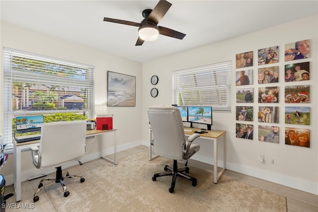 office featuring baseboards and a ceiling fan