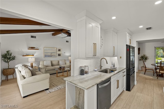 kitchen with visible vents, a sink, vaulted ceiling with beams, light stone counters, and stainless steel dishwasher