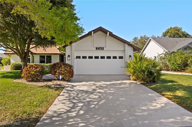 ranch-style house with a front lawn, an attached garage, driveway, and stucco siding