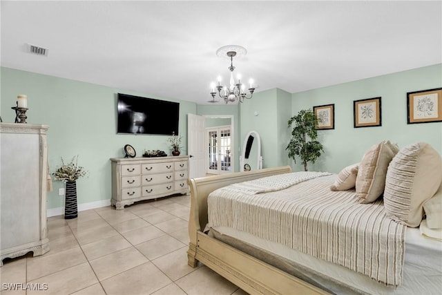 bedroom with a notable chandelier, light tile patterned floors, baseboards, and visible vents