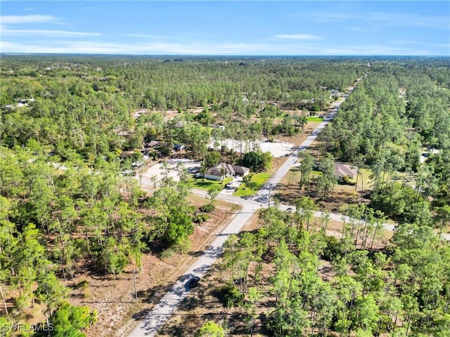 drone / aerial view with a view of trees