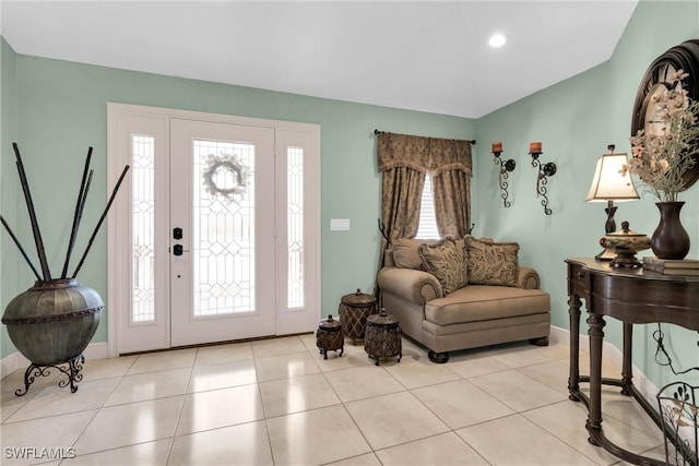tiled foyer with baseboards