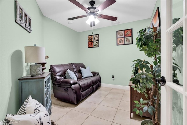 living area with ceiling fan, visible vents, baseboards, and light tile patterned flooring