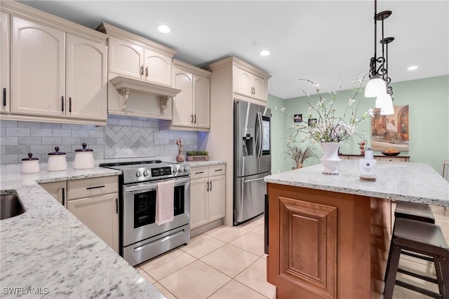 kitchen featuring backsplash, a kitchen island, decorative light fixtures, a kitchen breakfast bar, and stainless steel appliances
