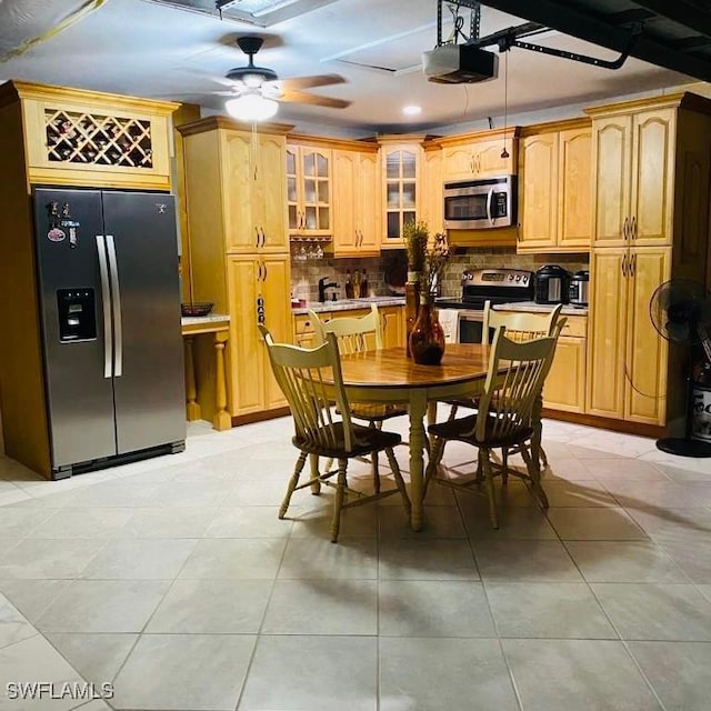 dining space with light tile patterned flooring and recessed lighting