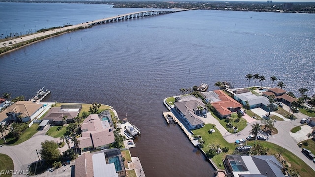 drone / aerial view featuring a residential view and a water view