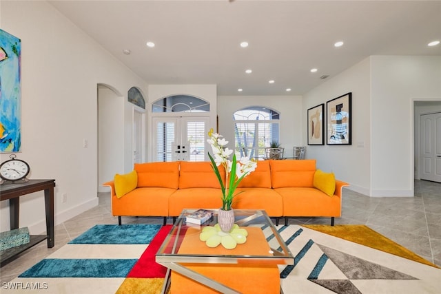 living area featuring recessed lighting, french doors, baseboards, and light tile patterned floors