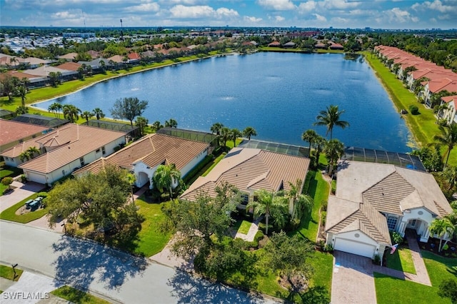 birds eye view of property with a water view and a residential view