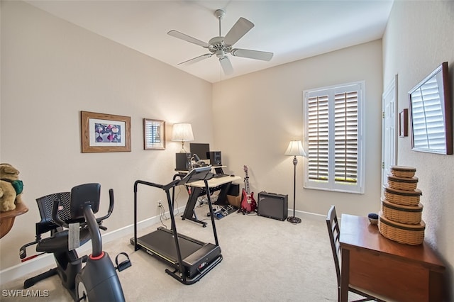 exercise room with carpet, baseboards, and ceiling fan