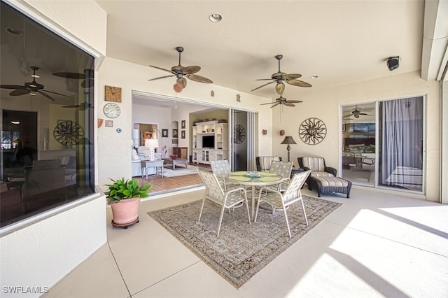 view of patio featuring outdoor dining space and ceiling fan