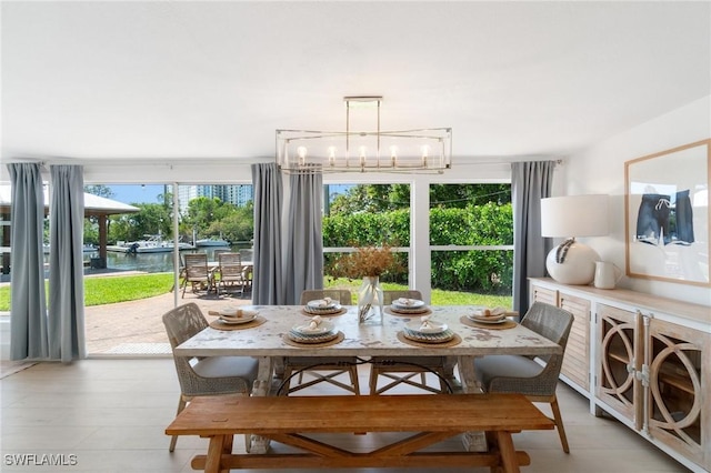 dining room featuring a wealth of natural light and a chandelier