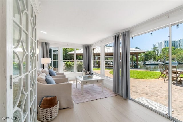 sunroom with a water view