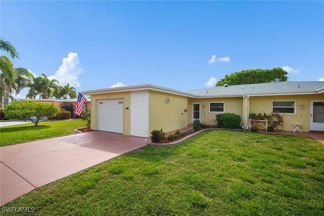 ranch-style home with a garage, a front yard, concrete driveway, and stucco siding