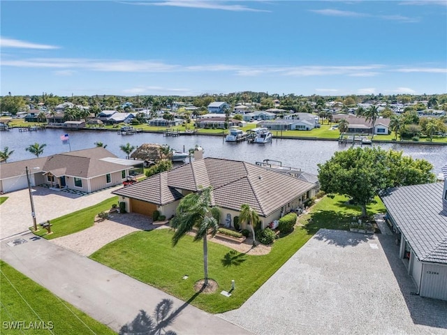 aerial view featuring a residential view and a water view