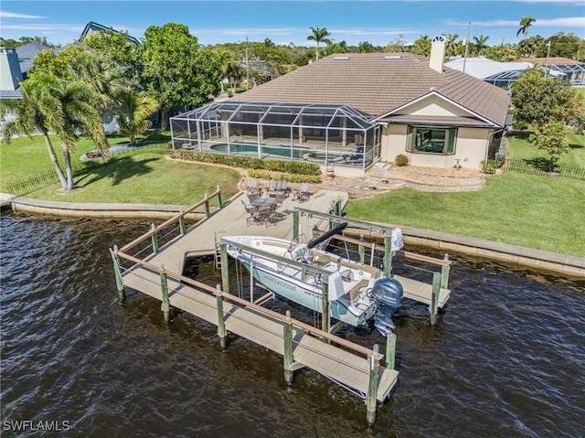 dock area featuring a yard, a water view, and boat lift