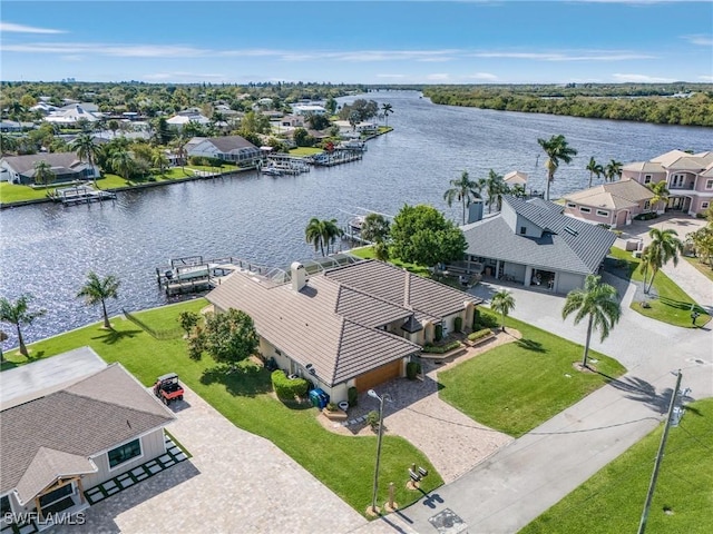 aerial view with a residential view and a water view