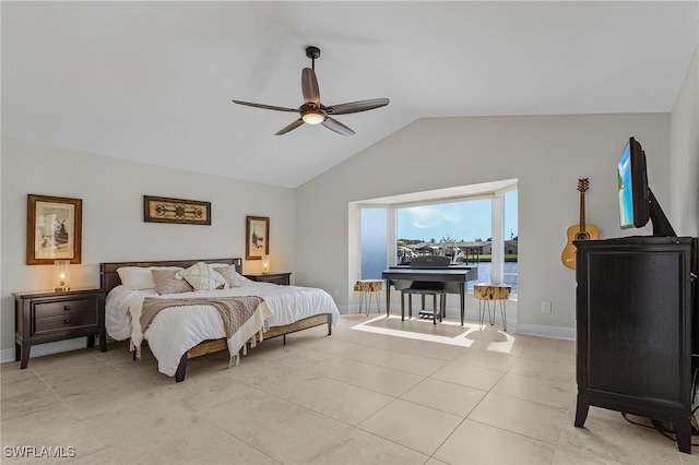 bedroom featuring light tile patterned floors, a ceiling fan, baseboards, and vaulted ceiling