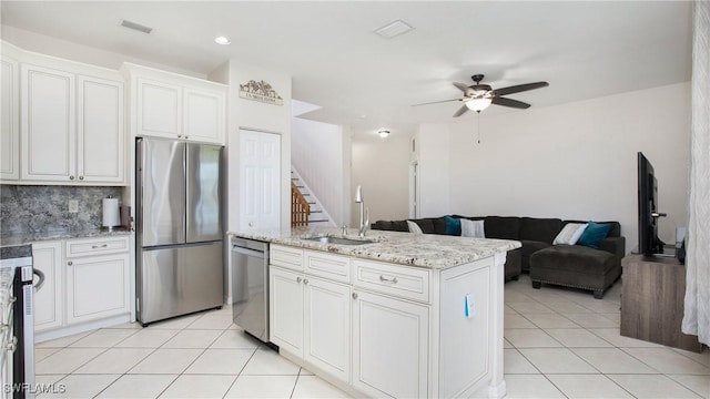kitchen featuring a sink, visible vents, appliances with stainless steel finishes, and light tile patterned floors