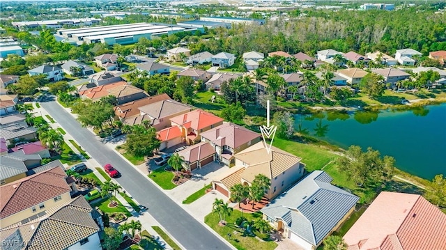 bird's eye view with a residential view and a water view