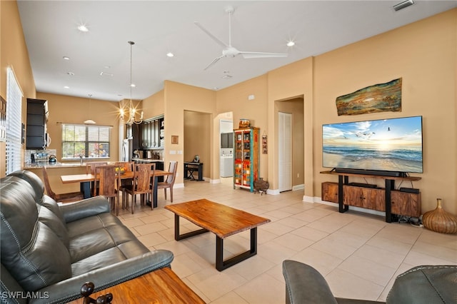 living room featuring ceiling fan with notable chandelier, visible vents, recessed lighting, and light tile patterned floors