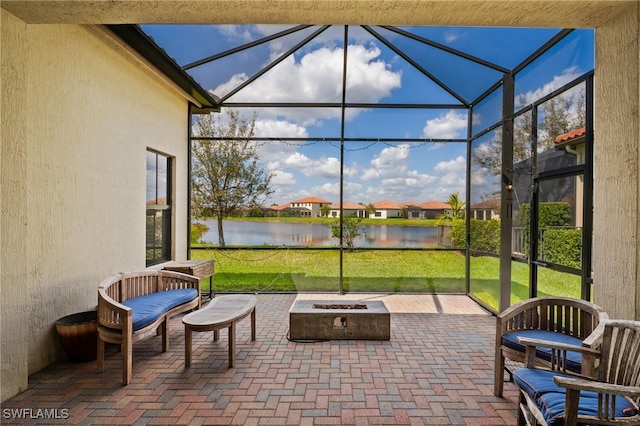 sunroom / solarium with a water view