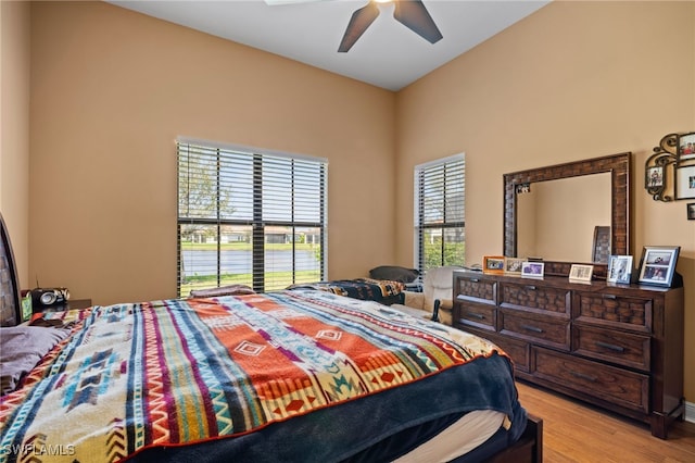 bedroom with light wood-style floors and ceiling fan