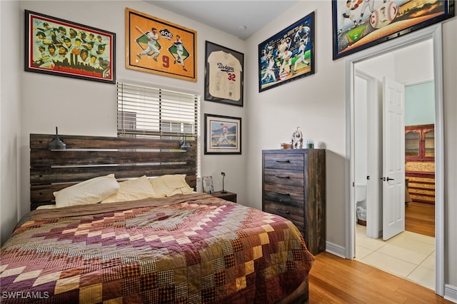 bedroom with wood finished floors