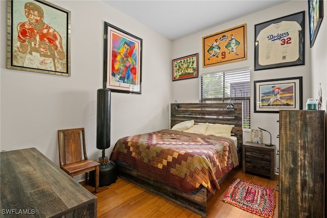 bedroom featuring wood finished floors