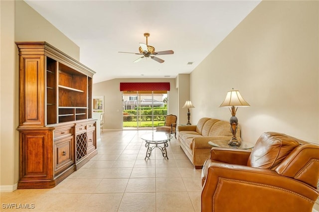 living area with light tile patterned floors, visible vents, baseboards, and ceiling fan