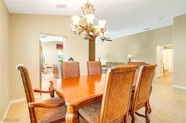 dining room featuring visible vents, light tile patterned flooring, baseboards, a chandelier, and vaulted ceiling