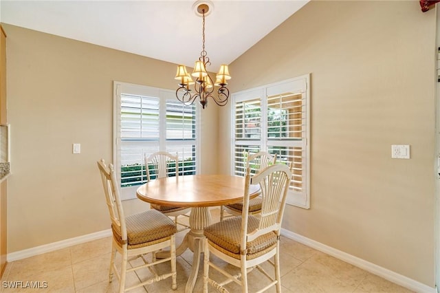 dining space featuring a chandelier, baseboards, light tile patterned flooring, and vaulted ceiling