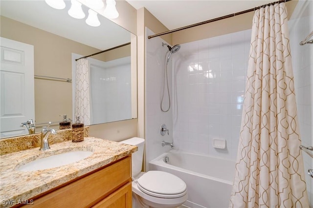 full bath with toilet, shower / bath combo, and vanity