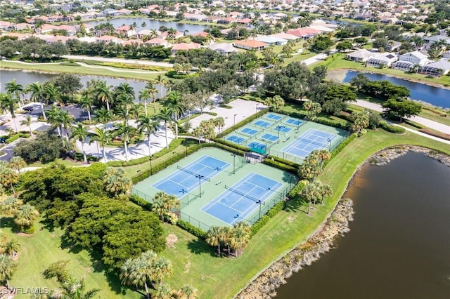 birds eye view of property with a water view and a residential view