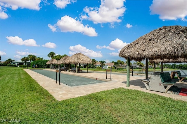 view of property's community with a gazebo and a yard