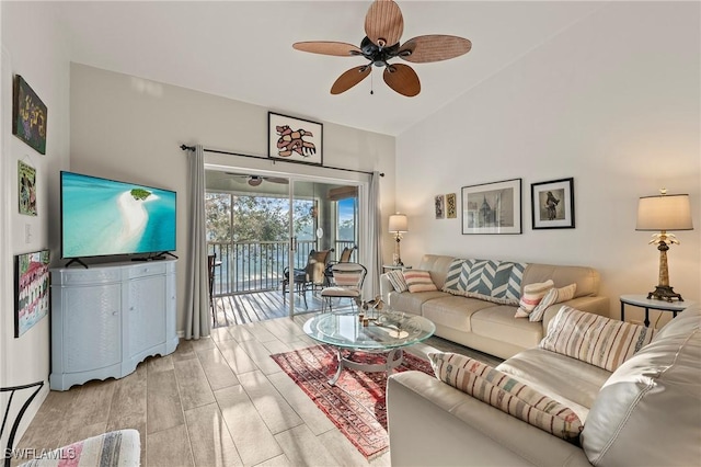 living area with a ceiling fan and light wood-type flooring