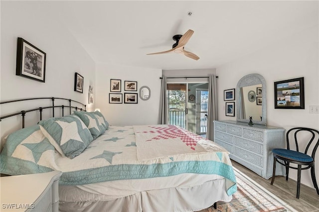 bedroom featuring ceiling fan, wood finished floors, and access to exterior