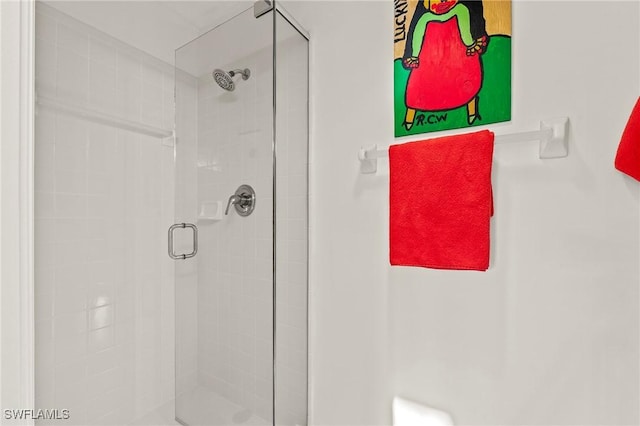 bathroom with a shower stall