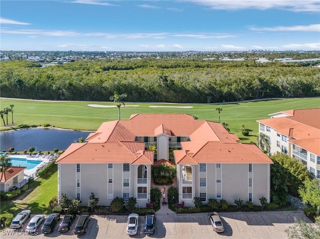 aerial view featuring golf course view and a water view