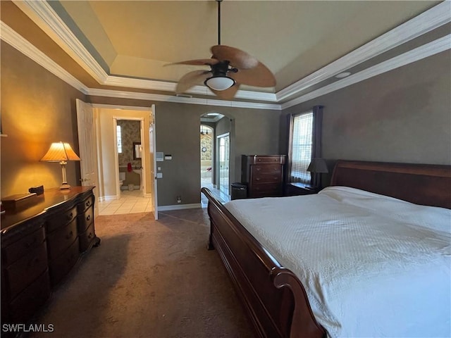 2016 El Dorado Pkwy W, Cape Coral, FL 33914 - bedroom featuring crown molding, baseboards, carpet floors, arched walkways, and a raised ceiling