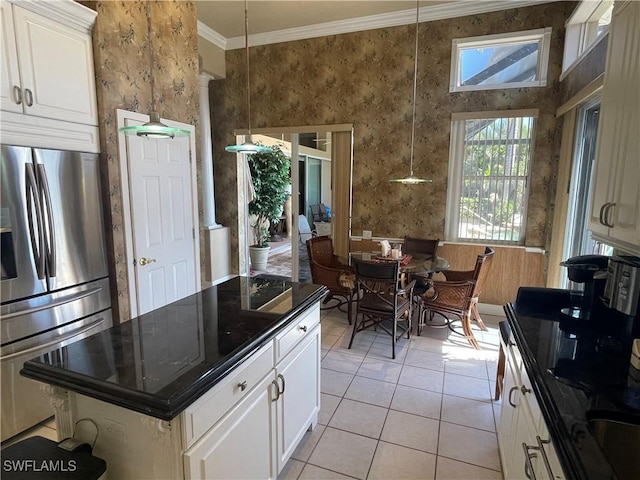 2016 El Dorado Pkwy W, Cape Coral, FL 33914 - kitchen featuring dark countertops, light tile patterned floors, crown molding, and stainless steel refrigerator with ice dispenser