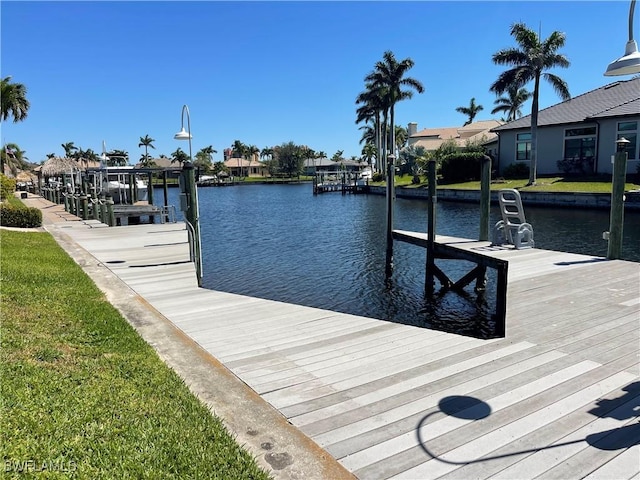 2016 El Dorado Pkwy W, Cape Coral, FL 33914 - dock area featuring a water view and boat lift