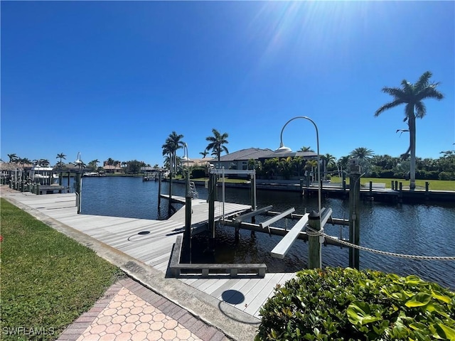 view of dock featuring a water view and boat lift