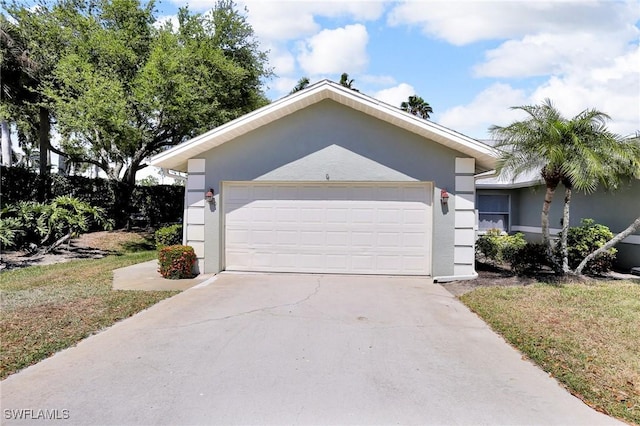 ranch-style house featuring stucco siding, driveway, and a garage