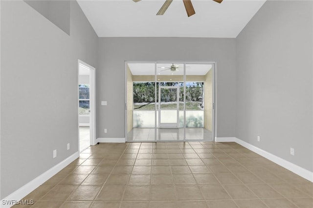 unfurnished room featuring light tile patterned flooring, baseboards, and ceiling fan