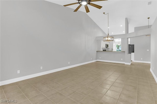 unfurnished living room with visible vents, a ceiling fan, recessed lighting, light tile patterned floors, and baseboards