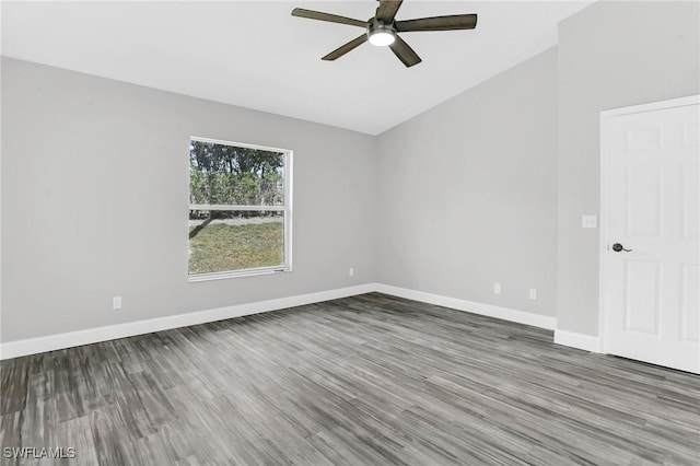 empty room with wood finished floors, baseboards, and ceiling fan